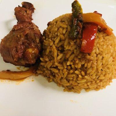 Jollof with stewed chicken.