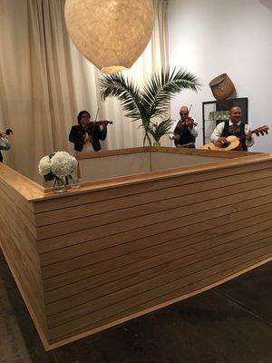 Mariachi players around an opening to lower level . I hope to see the entire store on my next visit .