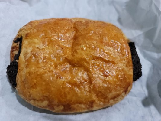 Chocolate croissant, big and flaky. Chocolate filling is a nice creamy paste and did not harden when eaten at room temp.