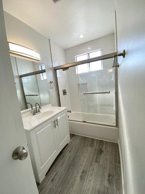 Beautiful bathroom, subway tiles, new flooring and lighting