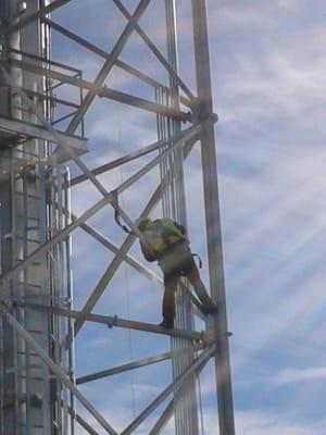 Install electrical conduit on grain elevator.