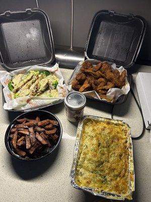 Chicken over rice, macaroni and cheese, wings and fries