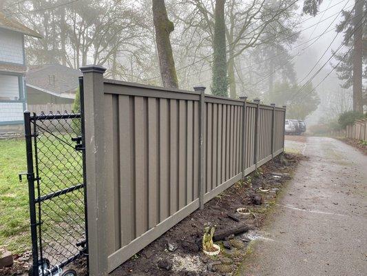 Trex fence with chain link rolling gate