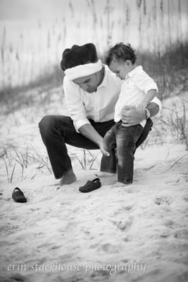 Father Helping Son into Shoes on Amelia Island Beach