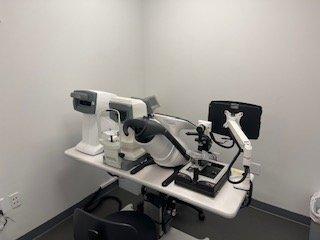 Step into our pre-exam room where cutting-edge machinery ensures a thorough eye health check for optimal vision.