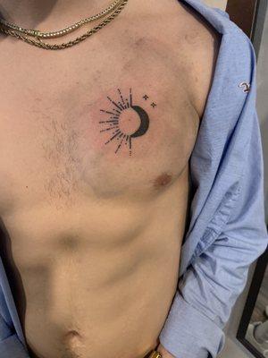 Chest Tattoo - The sun, moon, and its stars