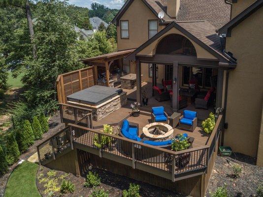 Trex composite deck with low maintenance handrail and pvc trim.  Includes a custom kitchen, hot tub and retractable screen porch.