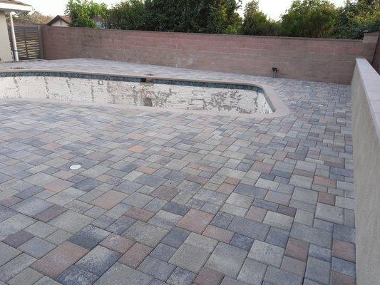 paver instalation pool deck.