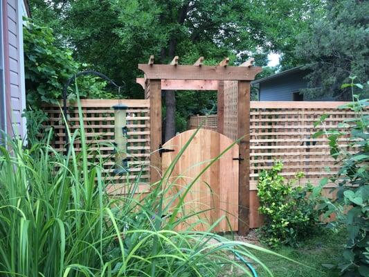 This is a small portion of a unique and beautiful fence and arbor we completed in northwest Fort Collins, CO.