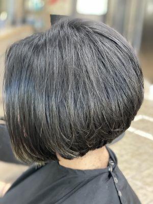 Bob haircut with graduated layers in the back for volume