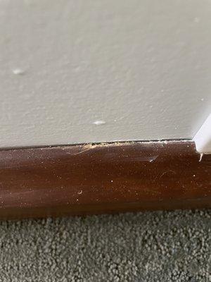 One of multiple sites where they scraped the paint off our baseboards.