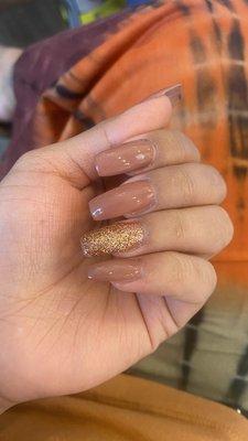 Medium length semi tapered square acrylic full set with nude and glitter polish