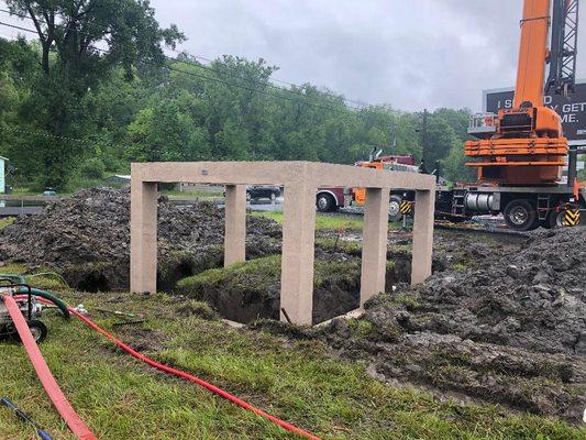 Pre-cast chainwall foundation set in Montour Falls. Communication shelter install coming next!