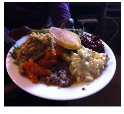 Mustard greens, blackeye peas, string beans, candied yams, conrbread dressing, macaroni salad, cornbread, cranberry sauce