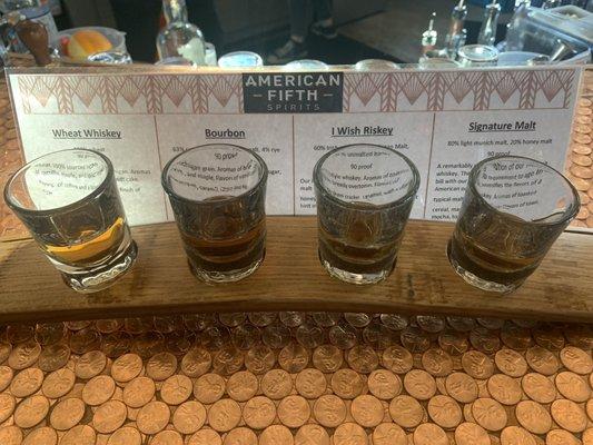 One of their whiskey flights of house distilled spirits.