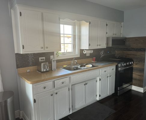 BEFORE: ugly soffit, old school design, colors too dark for small kitchen.