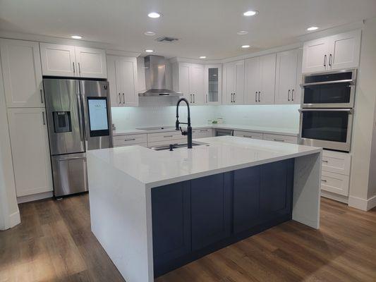 White shaker cabinets with Navy Blue