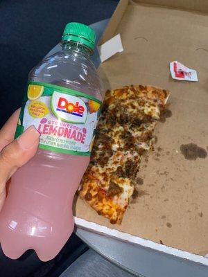 Half eaten pizza & a drink