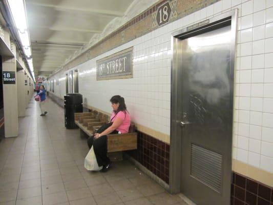 18th street is a traditional long, narrow IRT local station that preserves the original mosaics.