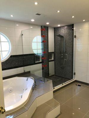 Frameless shower door.  90° frameless shower door with chrome hardware installed by Agc glass contract call for a free estimate