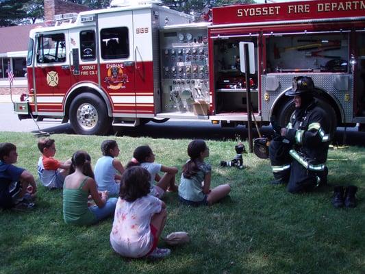 SFD Fire Prevention Officer on the job in full turnout gear with school kids.