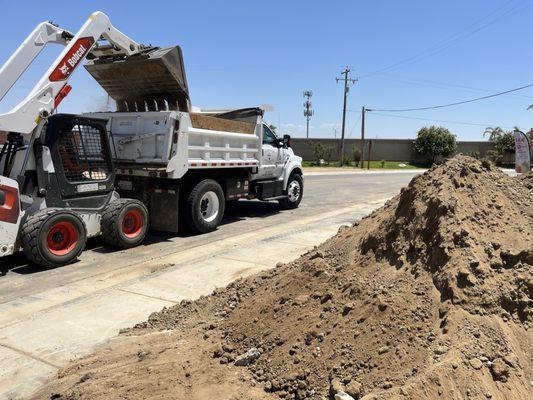 Dirt grading, and dirt hauling