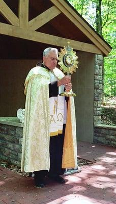 Fr. Andre Schludecker Blesses the Tome Dedicated to the Unborn at the Marian Center in Joy Valley. Petoskey, MI