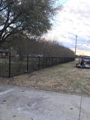 Wrought iron fence with matching custom driveway gate!