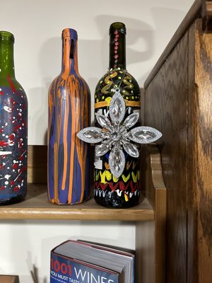 Painted wine bottles by the owner and cute wine bottle decor