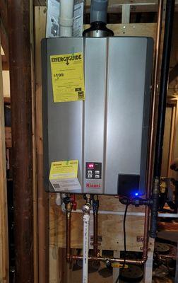 Tankless water heater with hot water recirculation schedule controlled from your phone.