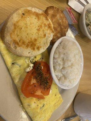 Tomato, feta, and basil omelet with grits and biscuit