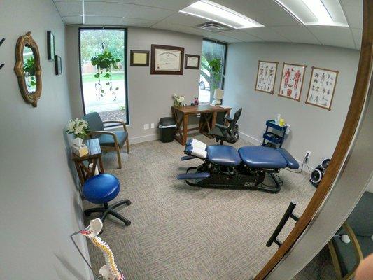 Spacious welcoming treatment rooms with privacy sliding barn doors.