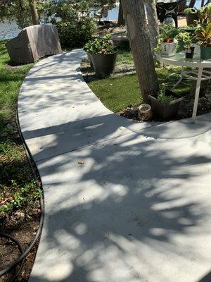 Matt gave us an elegantly curved walkway and patio. It ties the lanai to our deck.