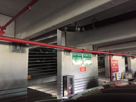 parking info signs inside parking garage