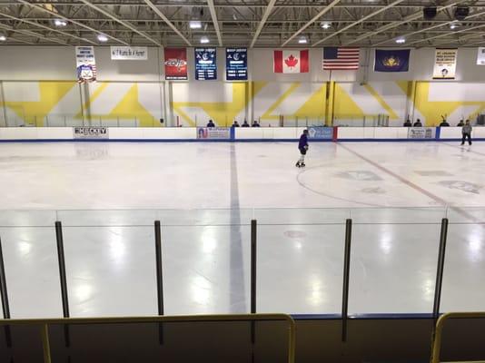 Looking at middle area of ice rink from seats