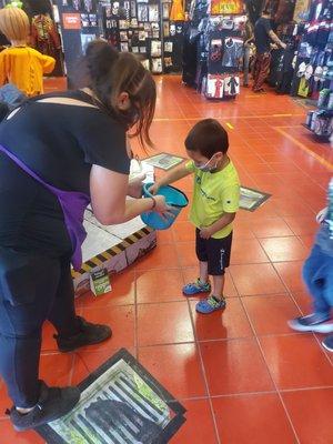 Employees passing out candy