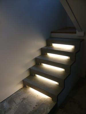 Concrete staircase with under tread lighting