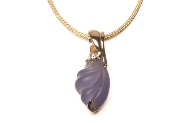 Hand carved chalcedony and diamond with 14 k gold.