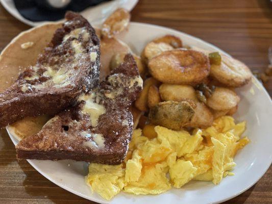 French toast, pancake, eggs with cheddar cheese and potatoes