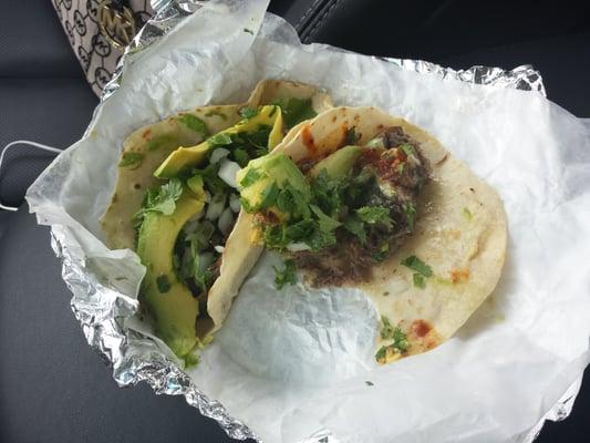 Beef taco with scenario, cilantro onions and both green and red sauce