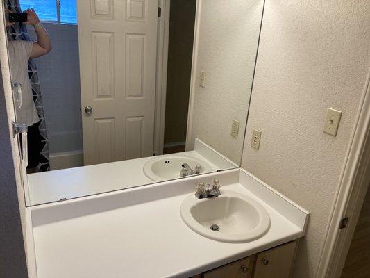 Clean bathroom sink and mirror