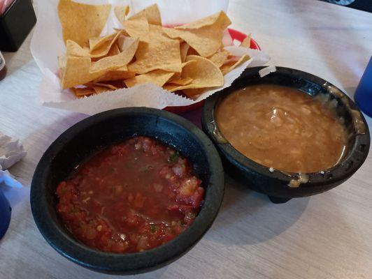 Chips, salsa and gravy with cheese