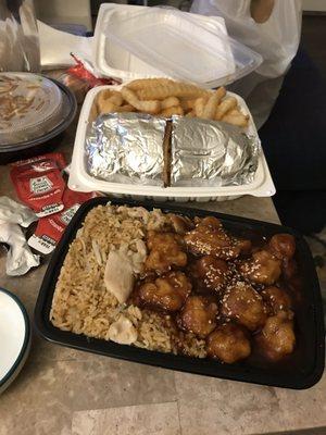 Sesame chicken, chicken fried rice combo, crab cake sandwich and fries