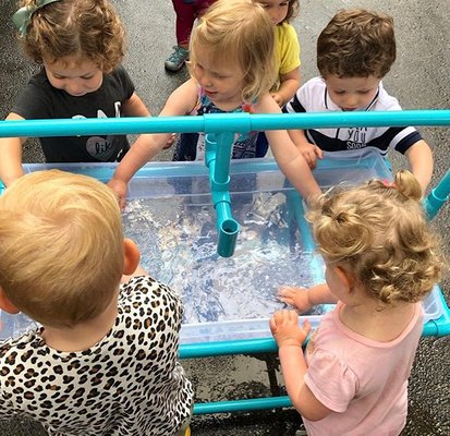 The friends were so excited to go outside and play at the water table! They rescued animals, searched for seashells, and cleaned their boats