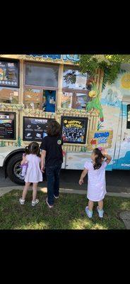 Hector helping out my little guest to some Kona Ice