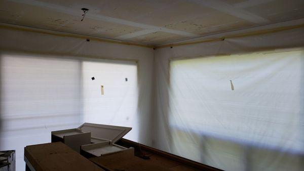 Post-abatement photo of our dining area and "demo'd" hanging kitchen cabinets.