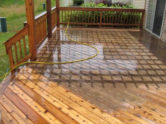 Aqua Pro Power Washers working on deck.