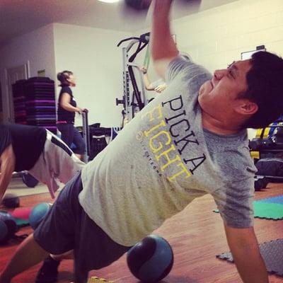 Reo, working the side plank press.  Core and stability :)