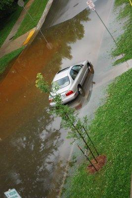 My car in deep water in a flash flood beneath the building.