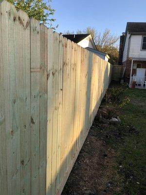 Another happy customer! 75 feet of new pressure treated wood fence